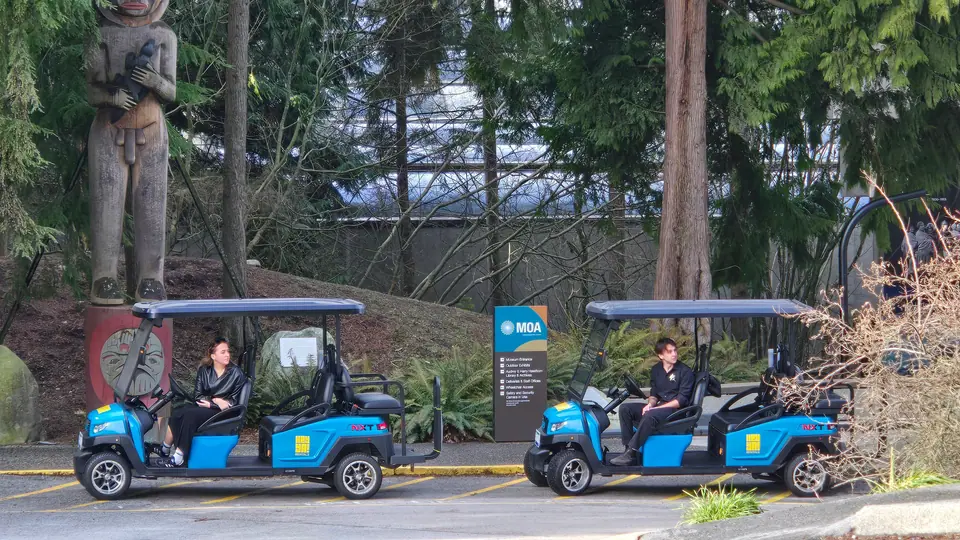 Two HeyYa carts parked by a museum entrance in Vancouver