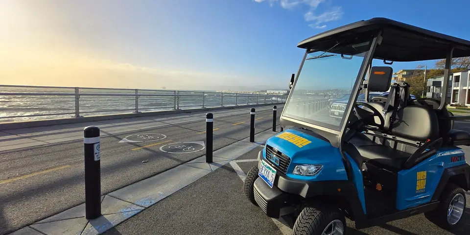 A HeyYa cart parked along the Dallas Road waterfront in Victoria at sunrise