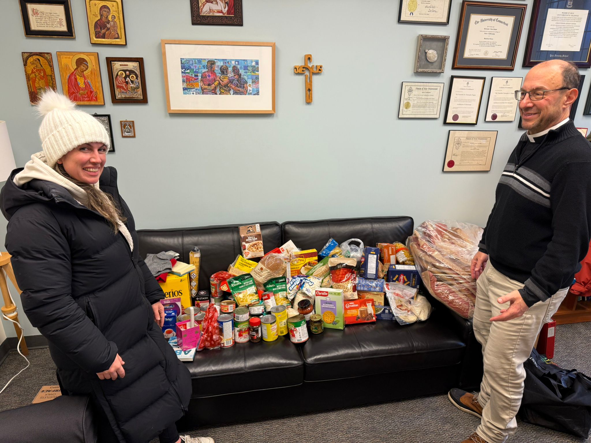 CEO Natasha Maynard and The Very Rev. Christopher A. Pappas with food donation